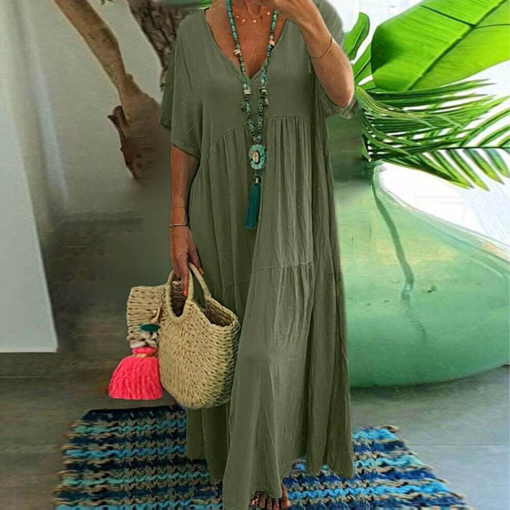 Grünes Coraline Sommerkleid, ideal für Sommerausflüge und Veranstaltungen, mit eleganter Passform und hochwertigem Material.