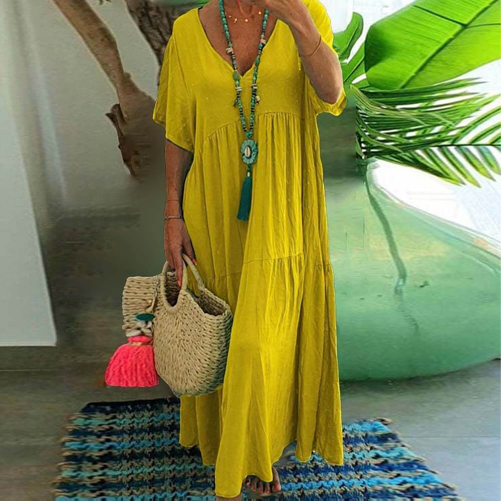 Gelbes Coraline Sommerkleid, ideal für eine fröhliche Sommergarderobe, passt sich jeder Figur an und bringt Farbe in Ihren Tag.