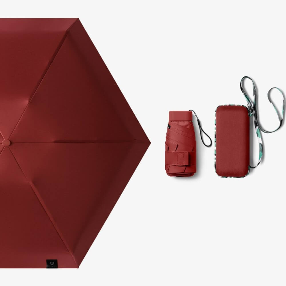 Roter ultraleichter Regenschirm – windbeständig und UV-geschützt für alle Wetterlagen.